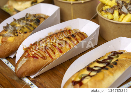 Assorted Gourmet Hot Dogs with Mustard, Ketchup and Melted Cheese. High quality photo 134785853