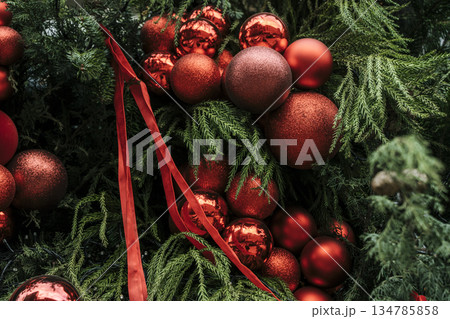 Festive Christmas Tree Decorated with Red Baubles and Ribbons. High quality photo Festive Christmas Tree Decorated with Red Baubles and Ribbons. High quality photo 134785858