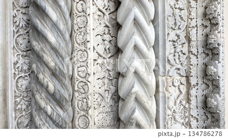 Ornate italian romanesque marble carving with twisted column details Ornate italian romanesque marble carving with twisted column details 134786278