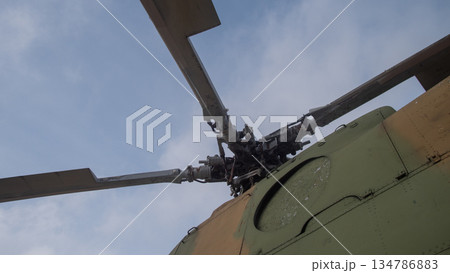 wide view helicopter rotor sweep against cloudy sky, balanced blade geometry and structural detail, wide view helicopter rotor sweep against cloudy sky, balanced blade geometry and structural detail, 134786883