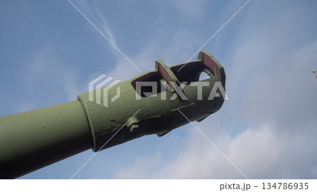 close-up helicopter tail boom showing exhaust and chipped paint, rivets and ventilation openings, signs 134786935