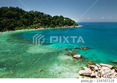 Top view of the coral reef with crystal clear water and rocky formations on the Perhentian Islands. Malaysia 134787119