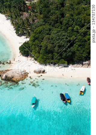 Aerial view of a tropical beach with white sand and coral reef on the island of Lang Tengah, Terengganu, Malaysia Aerial view of a tropical beach with white sand and coral reef on the island of Lang Tengah, Terengganu, Malaysia 134787130
