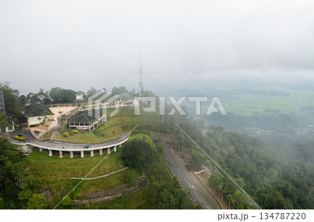 Aerial view of GUNUNG RAYA mountain peak on Langkawi Island with telecommunication tower and abandoned hotel 134787220