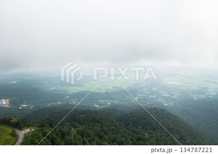 Aerial view of the top of Mount GUNUNG RAYA in the clouds on Langkawi Island 134787221
