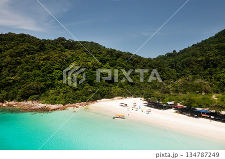 View of the tropical beach on Redang Island. A boat at Turtle Beach on a sunny day. Malaysia 134787249