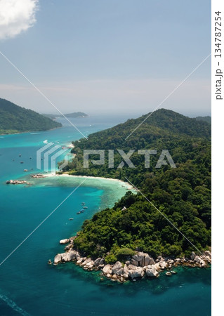 Stunning aerial view of a tropical island with lush greenery and clear waters on a bright sunny day in the Perhentian Islands. Malaysia 134787254