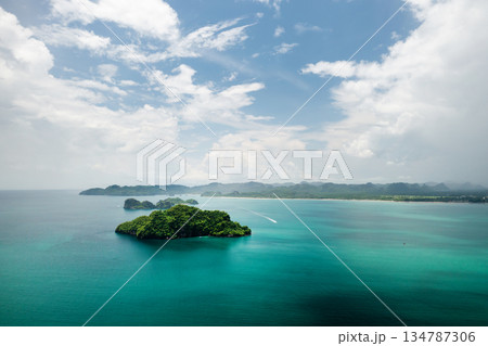 Scenic view of lush green islands and calm waters on a sunny day on the tropical island of Langkawi. Malaysia Scenic view of lush green islands and calm waters on a sunny day on the tropical island of Langkawi. Malaysia 134787306