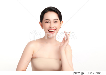 A beautiful young Asian woman with clean, fresh skin against a white background. Skincare, facial treatment, cosmetology, beauty, and spa. An elegant portrait of an Asian woman. A beautiful young Asian woman with clean, fresh skin against a white background. Skincare, facial treatment, cosmetology, beauty, and spa. An elegant portrait of an Asian woman. 134789858