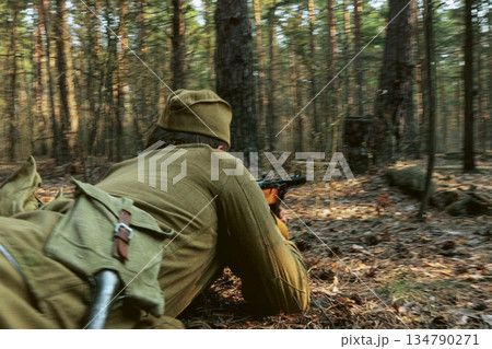 Russian Soviet Infantry Red Army Soldiers Of World War II with weapons Running On Forest Battlefield in attack 134790271