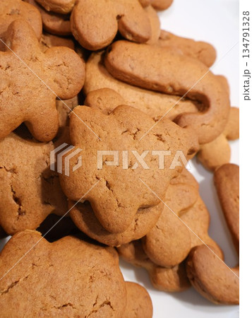 Golden Gingerbread Cookies in Fun Shapes, Perfect for Holiday Baking, Family Gatherings, and Sharing Golden Gingerbread Cookies in Fun Shapes, Perfect for Holiday Baking, Family Gatherings, and Sharing 134791328
