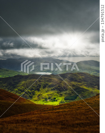Viewing moody landscape in Killarney National Park with green mountains and a distant lake. 134791512