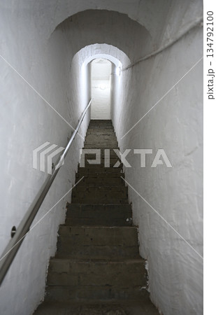 A narrow stairway in the wall of the old monastery 134792100