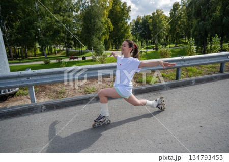 Caucasian woman in shorts roller skating.  134793453