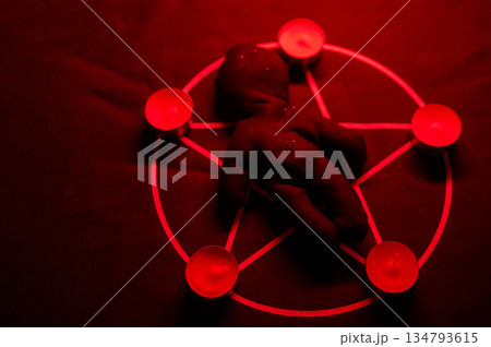 Voodoo doll on a pentagram. Witch spells. 134793615