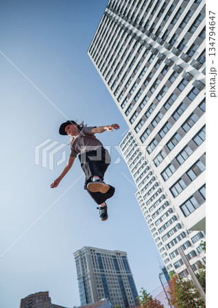 A girl jumps on a gymnastic trampoline. A girl jumps on a gymnastic trampoline. 134794647
