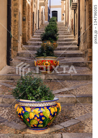 Colorful ceramic pots on a historic staircase in Cefalu, Sicily 134796085