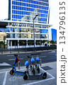Electric scooters and modern glass building in Tel Aviv 134796135