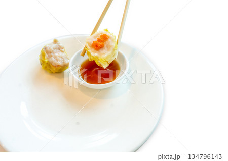 Top view of Shrimp dumplings in the yellow edge basket with chopsticks, focus selective 134796143