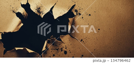 Torn paper edges revealing a brushed aluminum surface with paint splatters and texture 134796462