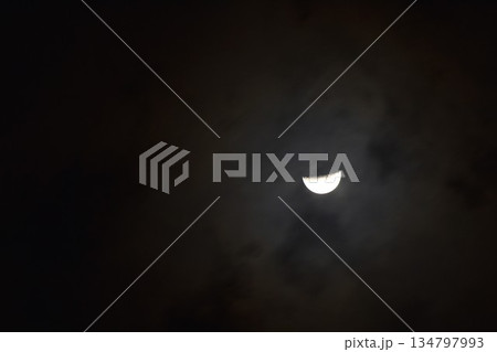 half moon covering by cloud floating on sky in night background 134797993