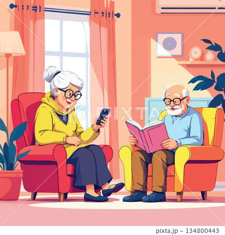 Vsai elderly couple relaxing in living room reading and using smartphone 134800443