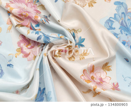 Craftsmanship. Embroidered brocade fabric for haute couture or decor. Colorful textile. 134800903