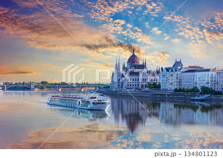 Aerial view of cruise ship and Budapest Parliament under sunrise sky, Hungary Aerial view of cruise ship and Budapest Parliament under sunrise sky, Hungary 134801123