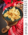 Dumplings with potato and cheese filling. 134801825