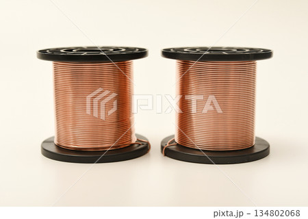 Copper coils on a white background. Copper wire for electronics. Pure copper. 134802068
