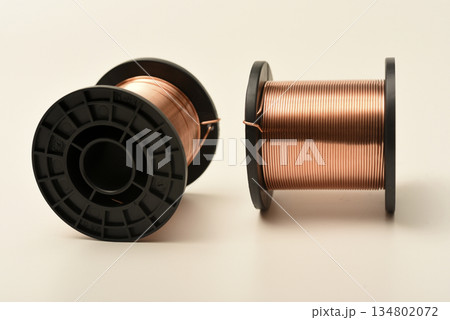 Copper coils on a white background. Copper wire for electronics. Pure copper. 134802072