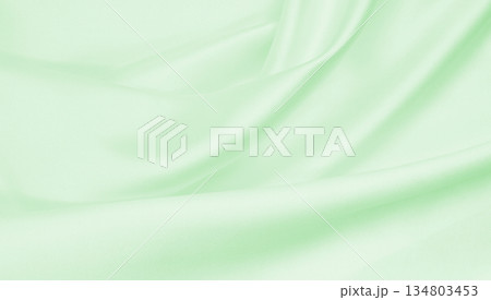 Smooth elegant green silk or satin luxury cloth texture as abstract background. Luxurious background design Smooth elegant green silk or satin luxury cloth texture as abstract background. Luxurious background design 134803453