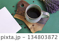 Ceramic mug with coffee on cutting board 134803872