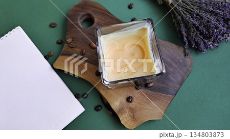 The candle with coffee on cutting board The candle with coffee on cutting board 134803873