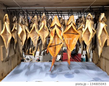 Hanging golden smoked fish in a smokehouse 134805043