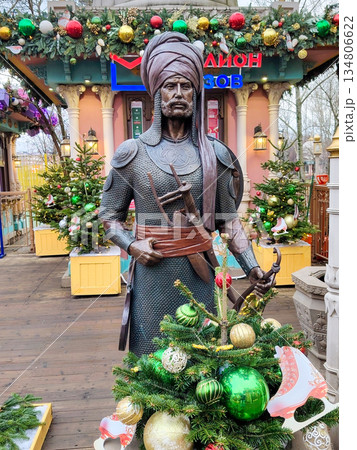 Indian Warrior Statue with Bow at Moscow Seasons Festival Fair Indian Warrior Statue with Bow at Moscow Seasons Festival Fair 134806622