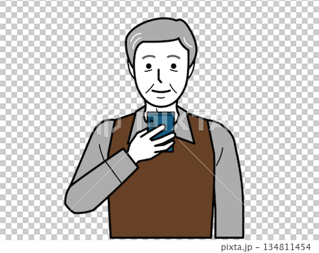 Front view. An elderly man wearing a shirt and vest looking at his smartphone. Front view. An elderly man wearing a shirt and vest looking at his smartphone. 134811454
