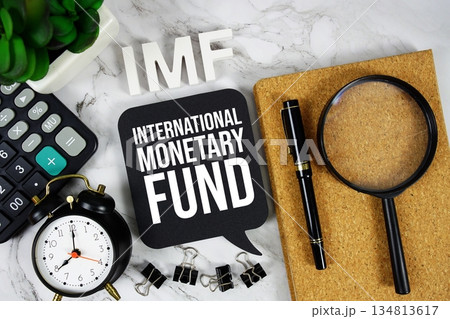 IMF - International Monetary Fund acronym with calculator, alarm clock and magnifying glass, business concept background IMF - International Monetary Fund acronym with calculator, alarm clock and magnifying glass, business concept background 134813617