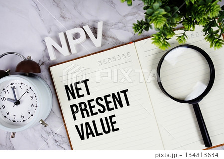 NPV - Net Present Value acronym on notepad, Business concept background NPV - Net Present Value acronym on notepad, Business concept background 134813634