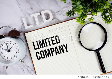 LTD - Limited Company acronym on notepad, Business concept background LTD - Limited Company acronym on notepad, Business concept background 134813635