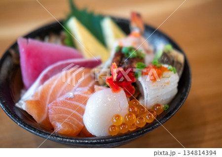 Kaisen Don, a Japanese rice bowl dish of seafood. Including raw fish such as Hotate, Salmon, Saba, Engawa, Ikura. 134814394