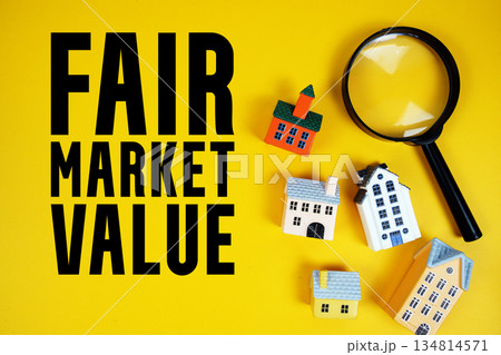 FMV Fair Market Value text with house models and magnifying glass on yellow background FMV Fair Market Value text with house models and magnifying glass on yellow background 134814571