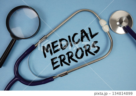 Medical Errors text with Stethoscope and magnifying glass on blue background Medical Errors text with Stethoscope and magnifying glass on blue background 134814899