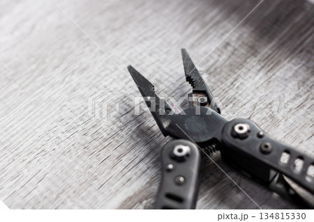 Compact multitool with textured grip, Multifunctional camping and repair tool with rugged design 134815330