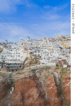 Drone view of clay cliffs in Santorini and Oia town with white houses built on the edge 134815512