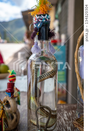 Alcohol bottle with a preserved snake in Peru Alcohol bottle with a preserved snake in Peru 134820304