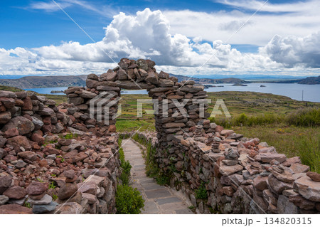 Stone pathway and arch at Pachatata archaeological site, Amantani Island, La ke Titicaca, Peru Stone pathway and arch at Pachatata archaeological site, Amantani Island, La ke Titicaca, Peru 134820315