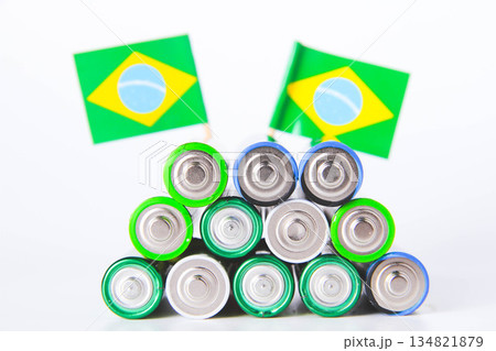 Battery. A lot of batteries on the background of the flag of the country. Battery. A lot of batteries on the background of the flag of the country. 134821879