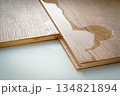 Laminate and water. Wooden floors are impervious to moisture. 134821894