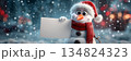 Portrait of a Smiling Snowman Dressed as Santa Claus Holding a Blank Festive Sign in a Snowy Winter Scene - Generative Ai 134824323